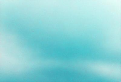 The primary subject of the image is a blue sky with clouds. The setting is a cloudy day, and the visual style is a photo. The dominant colors are blue and white, creating a calm and serene atmosphere.