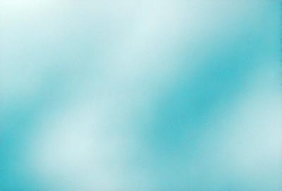 The primary subject of the image is a large, blue, cloudy sky. The setting is a vast, open space with no visible landmarks or objects. The visual style is a natural, outdoor scene with a focus on the sky. The colors and mood are predominantly blue, creating a serene and peaceful atmosphere.
