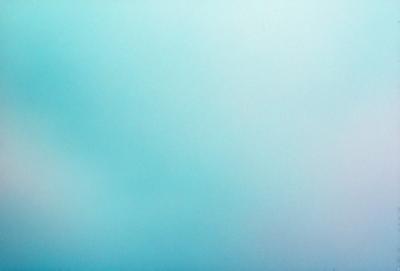 The primary subject of the image is a large, open, and cloudy sky. The setting is a vast, empty space with no visible landmarks or objects. The visual style is a natural, outdoor scene with a focus on the sky. The colors and mood of the image are predominantly blue, creating a serene and peaceful atmosphere.
