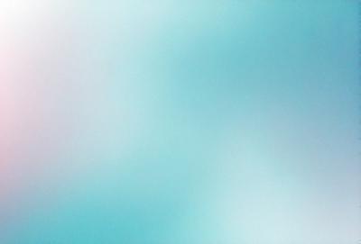 The primary subject of the image is a blue sky with clouds. The setting is a clear day with a blue sky, and the visual style is a photo. The colors and mood of the image are predominantly blue, creating a calm and serene atmosphere.