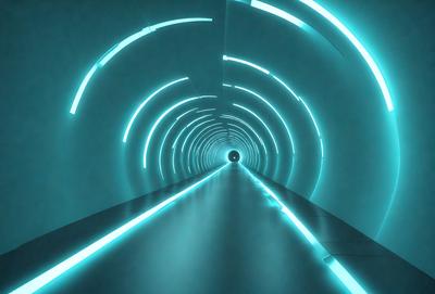 The primary subject of the image is a long, blue-lit tunnel. The setting is a futuristic environment, with the tunnel being illuminated by a blue light. The visual style is a digital art, as the tunnel appears to be a computer-generated image. The dominant colors are blue and white, creating a calm and futuristic atmosphere.