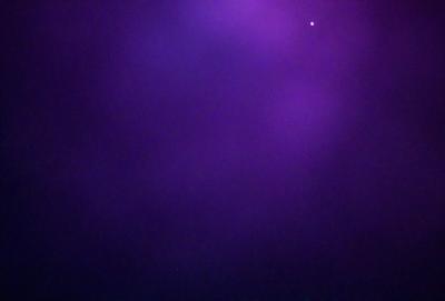 The primary subject of the image is a purple sky, which creates a unique and atmospheric setting. The sky is the main focus of the image, and it appears to be a photo of the sky rather than a digital art or illustration. The purple hue of the sky gives it a distinctive and somewhat mysterious appearance.
