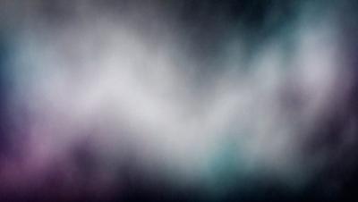 The primary subject of the image is a purple and blue cloudy sky. The setting is a dark, cloudy background, which creates a moody atmosphere. The visual style is a photo, capturing the beauty of the cloudy sky. The dominant colors are purple and blue, which evoke a sense of calmness and tranquility.