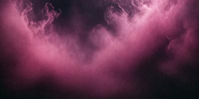 The primary subject of the image is a pink cloud, which is the main focus of the scene. The setting is a dark sky, and the visual style appears to be a photo. The dominant colors in the image are pink and purple, creating a warm and atmospheric mood.