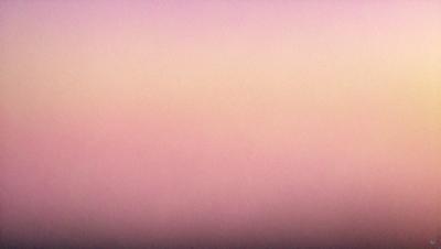 The primary subject of the image is a pink sky, which creates a serene and calming atmosphere. The setting is a cloudy sky, and the visual style appears to be a photo. The dominant colors are pink and purple, which contribute to the overall mood of the scene.