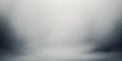 The primary subject of the image is a cloudy sky. The setting is a vast, open space with no visible landmarks or objects. The visual style is a black and white photo, which adds a sense of timelessness and nostalgia to the scene. The colors and mood of the image are predominantly dark and moody, with the clouds creating a dramatic backdrop against the sky.