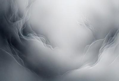 The primary subject of the image is a cloudy sky. The setting is a cloudy day, and the visual style is a black and white photo. The colors and mood of the image are predominantly dark and moody, with the clouds creating a dramatic atmosphere.