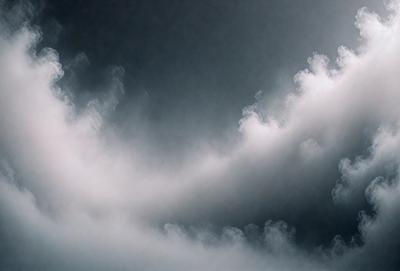 The primary subject of the image is a cloudy sky. The setting is a dark, cloudy day with a gloomy atmosphere. The visual style is a photo of the sky, showcasing the clouds and their patterns. The colors and mood are predominantly dark and moody, with the clouds being the main focus of the image.