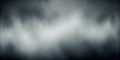 The primary subject of the image is a cloudy sky. The setting is a dark, cloudy environment, which creates a moody atmosphere. The visual style is a black and white photo, giving it a classic and timeless appearance.