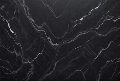 The primary subject of the image is a black marble countertop. The setting is a kitchen, with the countertop being the main focus of the scene. The visual style is a close-up of the marble countertop, showcasing its texture and pattern. The colors and mood of the image are predominantly dark, with the black marble countertop being the main source of contrast.