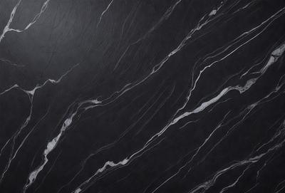 The primary subject of the image is a marble countertop with a black background. The visual style is a close-up of the marble countertop, showcasing its texture and pattern. The colors and mood of the image are predominantly black and white, giving it a sleek and modern appearance.