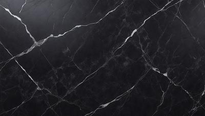 The primary subject of the image is a black marble countertop. The setting is a kitchen, with the countertop being the main focus of the scene. The visual style is a close-up of the marble countertop, showcasing its texture and pattern. The colors and mood of the image are predominantly dark, with the black marble countertop being the main source of contrast.