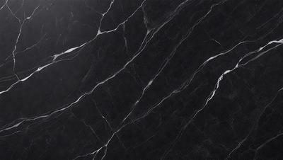 The primary subject of the image is a black marble countertop. The setting is a kitchen, with the countertop being the main focus of the scene. The visual style is a close-up of the marble countertop, showcasing its texture and pattern. The colors and mood of the image are predominantly dark, with the black marble countertop being the main source of contrast.