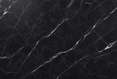The primary subject of the image is a close-up of a marble countertop. The setting is a kitchen, with the marble countertop being the main focus of the scene. The visual style is a photo, showcasing the natural texture and patterns of the marble. The colors and mood of the image are predominantly black and white, giving it a classic and elegant appearance.