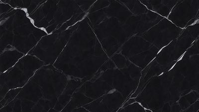 The primary subject of the image is a black marble countertop. The setting is a kitchen, with the countertop being the main focus of the scene. The visual style is a close-up of the marble countertop, showcasing its texture and pattern. The colors and mood of the image are predominantly dark, with the black marble countertop being the main source of contrast and visual interest.