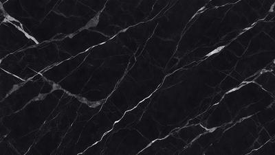 The primary subject of the image is a black marble countertop. The setting is a kitchen, with the countertop being the main focus of the scene. The visual style is a close-up of the marble countertop, showcasing its texture and pattern. The colors and mood of the image are predominantly dark, with the black marble countertop being the main source of contrast.