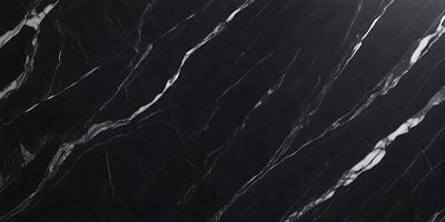 The primary subject of the image is a black marble countertop. The setting is a kitchen, with the countertop being the main focus of the scene. The visual style is a close-up of the marble countertop, showcasing its texture and pattern. The colors and mood of the image are predominantly dark, with the black marble countertop being the main source of contrast and visual interest.