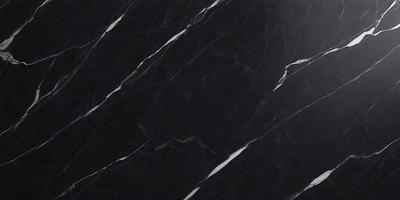 The primary subject of the image is a black marble countertop. The setting is a kitchen, with the countertop being the main focus of the scene. The visual style is a close-up of the marble countertop, showcasing its texture and pattern. The colors and mood of the image are predominantly dark, with the black marble providing a striking contrast against the surrounding environment.