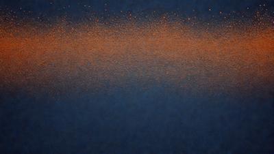 The primary subject of the image is a blue background with a red and orange gradient. The setting is a dark blue background, and the visual style appears to be a digital art or illustration. The dominant colors are blue, red, and orange, creating a vibrant and energetic atmosphere.