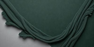 The primary subject of the image is a green cloth, which is the main object, scene, or focus of the image. The setting or background is a white surface, and the visual style is a photo. The colors and mood of the image are predominantly green, giving it a calm and soothing atmosphere.