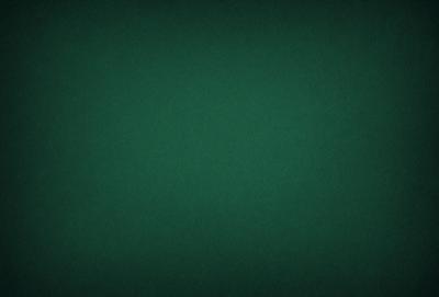 The primary subject of the image is a green background. The setting is a dark room, and the visual style is a photo. The dominant colors are green, and the overall atmosphere is calm and serene.