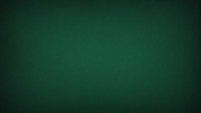 The primary subject of the image is a green tablecloth. The setting is a dark room with a green background. The visual style is a close-up of the green tablecloth. The colors and mood are predominantly green, creating a calm and soothing atmosphere.