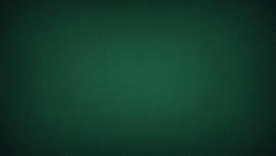The primary subject of the image is a green background. The setting is a dark room, and the visual style is a photo. The dominant colors are green, and the overall atmosphere is calm and serene.
