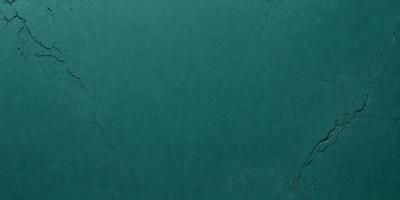 The primary subject of the image is a green background. The setting is a large, empty space with a smooth, unblemished surface. The visual style is a close-up of the green background, which appears to be a piece of fabric or a wall. The colors and mood of the image are predominantly green, creating a calm and serene atmosphere.
