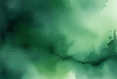 The primary subject of the image is a green, swirling, and cloudy background. The setting is a dark, cloudy sky, and the visual style is a painting or drawing. The colors and mood of the image are predominantly green, creating a calm and serene atmosphere.