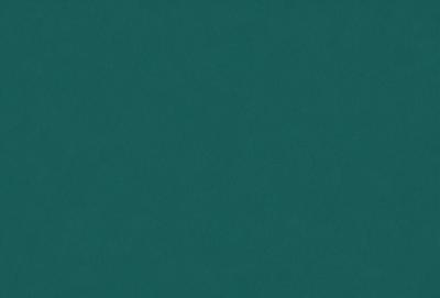 The primary subject of the image is a large, dark green surface. The setting is a dark green background, which creates a sense of depth and contrast. The visual style is a close-up of the green surface, emphasizing its texture and color. The colors and mood of the image are predominantly dark and moody, with the green surface serving as the main focal point.