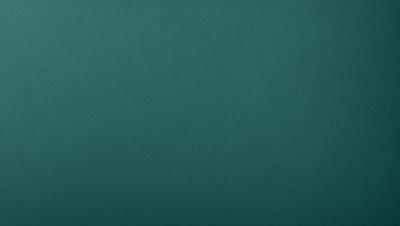 The primary subject of the image is a large, dark blue surface. The setting is a plain, empty room with no visible objects or people. The visual style is a close-up of the blue surface, which gives a sense of depth and texture. The colors and mood of the image are predominantly dark and moody, with the blue surface being the main focus.