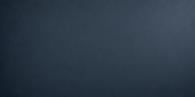 The primary subject of the image is a blue background. The setting is a dark, empty room with a blue wall. The visual style is a simple, monochromatic design. The colors and mood are predominantly dark and moody, with the blue color creating a sense of calmness and tranquility.
