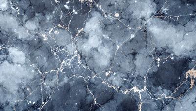 The primary subject of the image is a close-up of a marble wall with a blue and white color scheme. The setting is a stone wall, and the visual style is a photo. The dominant colors are blue and white, creating a calm and serene atmosphere.
