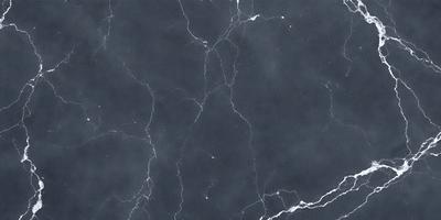 The primary subject of the image is a marble countertop with a black and white pattern. The setting is a kitchen, and the visual style is a photo. The countertop has a black and white marble pattern, and the overall atmosphere is elegant and sophisticated.
