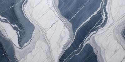 The primary subject of the image is a marble tile with a blue and white color scheme. The setting is a bathroom, as indicated by the presence of a marble countertop. The visual style is a close-up of the marble tile, showcasing its intricate patterns and textures. The colors and mood of the image are predominantly blue and white, creating a clean and elegant atmosphere.