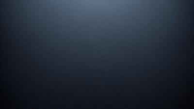 The primary subject of the image is a dark, empty space with no visible objects or details. The setting is a black background, and the visual style appears to be a photo or a digital art piece. The colors and mood of the image are predominantly dark and moody, creating a sense of emptiness and mystery.