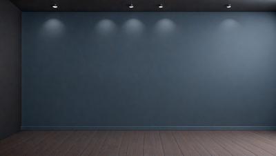 The primary subject of the image is a large, empty room with a blue wall. The setting is a room with a wooden floor, and the visual style is a photo. The dominant colors are blue and grey, creating a calm and serene atmosphere.