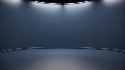 The primary subject of the image is a large, empty room with a blue wall. The setting is a dark room with a blue background, giving it a moody atmosphere. The visual style is a photo, capturing the empty room with a blue wall. The colors and mood of the image are predominantly blue, creating a calm and serene environment.