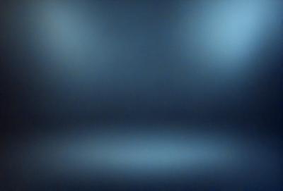 The primary subject of the image is a blue background with a white light source. The setting is a dark room, and the visual style is a combination of a photo and digital art. The dominant colors are blue and white, creating a calm and serene atmosphere.