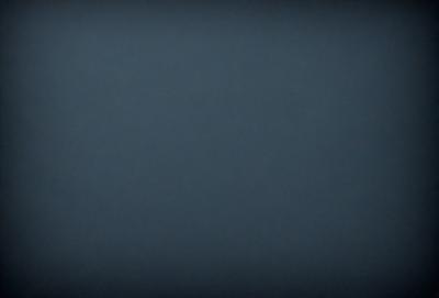 The primary subject of the image is a dark blue sky. The setting is a vast, open space with no visible landmarks or objects. The visual style is a simple, monochromatic image with no additional elements or textures. The colors and mood convey a sense of calmness and tranquility.