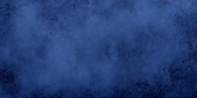 The primary subject of the image is a blue sky with a few clouds. The setting is a cloudy blue sky, and the visual style is a photo. The colors and mood of the image are predominantly blue, creating a calm and serene atmosphere.