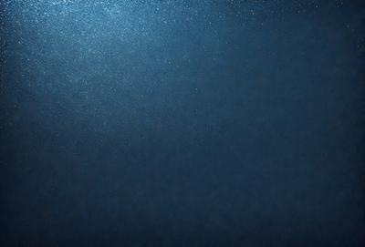 The primary subject of the image is a dark blue background with a few specks of light. The setting is a black background, and the visual style appears to be a photo. The colors and mood of the image are predominantly dark and moody, with the blue background creating a sense of depth and mystery.