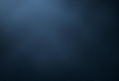 The primary subject of the image is a blue sky with no clouds. The setting is a dark blue background, which creates a contrast with the bright blue sky. The visual style is a photo, capturing the natural beauty of the sky. The colors and mood of the image are predominantly dark and moody, with the blue sky providing a sense of calmness and tranquility.