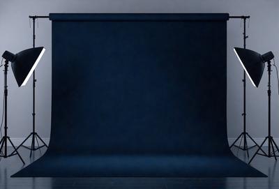 The primary subject of the image is a large, dark blue curtain. The setting is a room with a white wall behind the curtain. The visual style is a photo, and the colors and mood are dark and moody, with the blue curtain creating a dramatic and mysterious atmosphere.