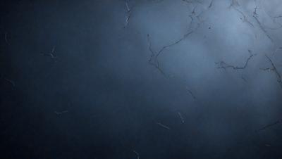 The primary subject of the image is a blue wall with a few white lines on it. The setting is a room with a blue background. The visual style is a close-up of the wall, and the colors and mood are predominantly blue and calm.