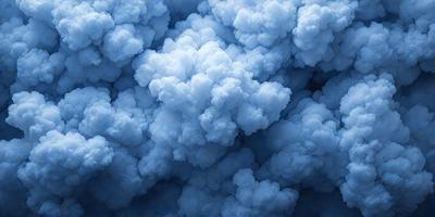 The primary subject of the image is a cloudy blue sky filled with fluffy white clouds. The setting is a vast, open sky, and the visual style is a natural, outdoor atmosphere. The colors and mood of the image are predominantly blue and white, creating a serene and peaceful ambiance.