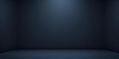 The primary subject of the image is a blue wall with a light shining on it. The setting is a dark room, and the visual style is a photo. The dominant colors are blue and black, creating a moody atmosphere.