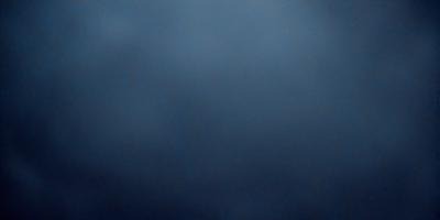 The primary subject of the image is a dark blue sky with no clouds. The setting is a cloudless sky, and the visual style is a photo. The colors and mood of the image are dark and moody, with the blue sky creating a sense of calmness and tranquility.