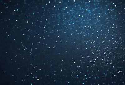 The primary subject of the image is a night sky filled with stars. The setting is a dark, starry background, and the visual style is a photo of the night sky. The colors and mood of the image are predominantly dark and serene, with the bright stars creating a sense of wonder and tranquility.