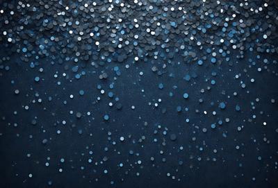 The primary subject of the image is a blue background with a pattern of silver glittery circles. The setting is a dark blue sky, and the visual style is a digital art or illustration. The dominant colors are blue and silver, creating a calm and serene atmosphere.